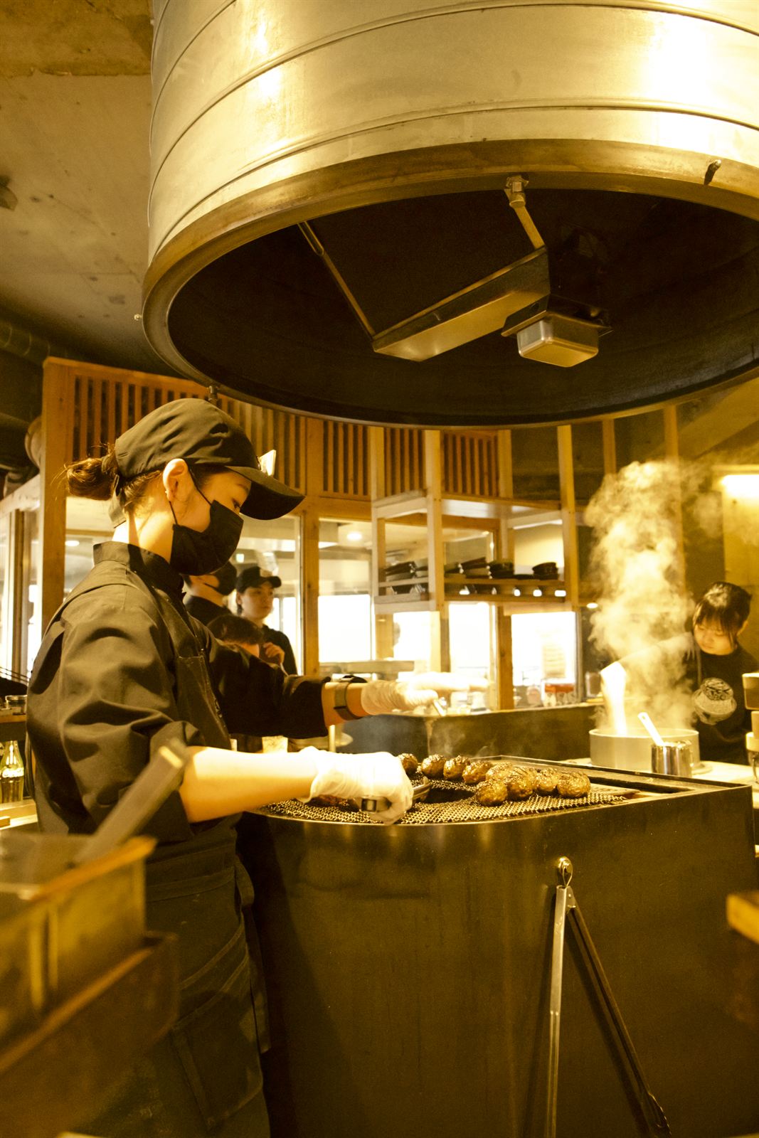 Charcoal grill in an open restaurant kitchen, Japan